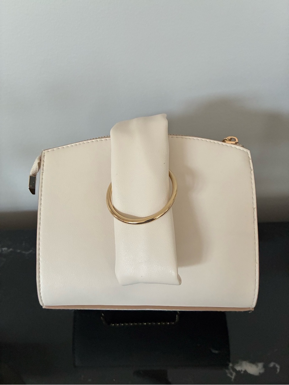 Elegant Cream Bag with Gold Ring Accent
